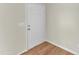 Entryway with a white front door and wood flooring at 430 Sir David Dr, Zebulon, NC 27597