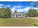 Quaint one-story home featuring a well-maintained lawn and traditional architectural details at 430 Sir David Dr, Zebulon, NC 27597