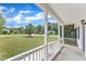 Covered front porch offering a relaxing outdoor space with a view of the neighborhood at 430 Sir David Dr, Zebulon, NC 27597