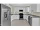 Spacious kitchen with stainless steel appliances, granite counters, and pristine white cabinets at 430 Sir David Dr, Zebulon, NC 27597