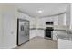 Kitchen with stainless steel appliances, granite countertops and white cabinets at 430 Sir David Dr, Zebulon, NC 27597