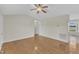 Spacious living room boasting gleaming hardwood floors, ample natural light, and convenient access to other rooms at 430 Sir David Dr, Zebulon, NC 27597