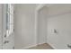 Bright mudroom featuring a white door, tiled flooring, and a convenient shelving unit for organized storage at 430 Sir David Dr, Zebulon, NC 27597