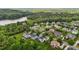Beautiful aerial view of the neighborhood, showcasing mature trees, landscaping and a lake at 4420 Bonnie Loch Dr, Burlington, NC 27215