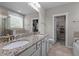 Bathroom featuring double sinks, granite countertops, and separate tub and shower at 4420 Bonnie Loch Dr, Burlington, NC 27215