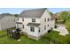 A rear exterior aerial view of a two-story home, featuring a wooden back deck and a fenced-in yard at 4420 Bonnie Loch Dr, Burlington, NC 27215