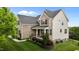 A two-story home with brick and siding and manicured lawn at 4420 Bonnie Loch Dr, Burlington, NC 27215