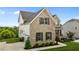 A beautiful home featuring brick and siding, a two-car garage, and professional landscaping at 4420 Bonnie Loch Dr, Burlington, NC 27215