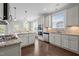 Modern kitchen featuring white cabinetry, stainless steel appliances, and granite countertops at 4420 Bonnie Loch Dr, Burlington, NC 27215