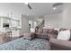 Living room featuring a fireplace, staircase and an open floor plan at 4420 Bonnie Loch Dr, Burlington, NC 27215