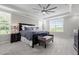Spacious main bedroom with a tray ceiling, large windows, and a dark wood bed frame at 4420 Bonnie Loch Dr, Burlington, NC 27215