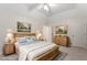 Spacious bedroom featuring a wood bed frame, matching nightstands, and serene artwork at 5 Wembley Ct, Durham, NC 27705