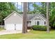 Charming single-story home with gray siding, mature trees, and well-maintained landscaping at 5 Wembley Ct, Durham, NC 27705