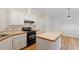 Bright kitchen with white cabinets, wood countertops, and hardwood floors at 5 Wembley Ct, Durham, NC 27705