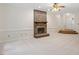 Spacious living room with a brick fireplace and neutral carpeting at 5 Wembley Ct, Durham, NC 27705