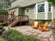 Backyard patio with wooden deck and two chairs with view of the lawn at 5116 Knaresborough Rd, Raleigh, NC 27612