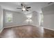 Spacious bedroom with hardwood floors, ceiling fan, and natural light at 5116 Knaresborough Rd, Raleigh, NC 27612