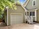 Exterior view of the home featuring a side entry garage and well maintained landscaping at 5116 Knaresborough Rd, Raleigh, NC 27612