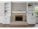 Living room fireplace with custom built-in cabinets and shelves at 5116 Knaresborough Rd, Raleigh, NC 27612