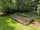Backyard fenced garden bed for planting vegetables and flowers at 5116 Knaresborough Rd, Raleigh, NC 27612