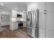 Modern kitchen featuring stainless steel appliances and beautiful white cabinetry at 5116 Knaresborough Rd, Raleigh, NC 27612