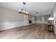 Spacious living room featuring hardwood floors, fireplace, and custom built-ins at 5116 Knaresborough Rd, Raleigh, NC 27612