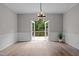Bright dining room featuring hardwood floors and French doors leading to the deck at 5116 Knaresborough Rd, Raleigh, NC 27612