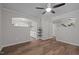 Bright living room with hardwood floors and views into the kitchen and entryway at 5116 Knaresborough Rd, Raleigh, NC 27612
