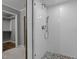 Bathroom featuring a glass enclosed tiled shower with pebble flooring at 5116 Knaresborough Rd, Raleigh, NC 27612