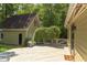 Private backyard with a spacious deck, beautiful green foliage, and a charming garden shed, perfect for relaxing at 520 Brittany Bay W, Raleigh, NC 27614