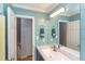 Stylish bathroom with shiplap walls, a sleek mirror and vanity, and a well-lit interior featuring a white countertop at 520 Brittany Bay W, Raleigh, NC 27614