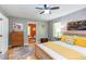 Bedroom featuring a wood bed frame with yellow accents, chest of drawers and hardwood floors at 520 Brittany Bay W, Raleigh, NC 27614