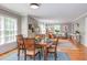 Open floor plan features a dining room leading to the living area, with a wooden table set for a meal at 520 Brittany Bay W, Raleigh, NC 27614