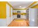 Bright kitchen features white cabinets, stainless steel appliances, and modern fixtures, showcasing a clean design at 520 Brittany Bay W, Raleigh, NC 27614