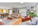 Spacious open-concept living room with hardwood floors, ample natural light, and stylish furnishings at 520 Brittany Bay W, Raleigh, NC 27614