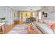 Inviting living room featuring hardwood floors, an open floor plan, neutral walls, and a glimpse of the dining area at 520 Brittany Bay W, Raleigh, NC 27614