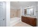 Bathroom featuring a soaking tub and a double vanity with granite counters at 520 Camden Yards Way, Cary, NC 27519