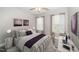 Bright bedroom with large windows, plush bedding, and a dedicated workspace at 520 Camden Yards Way, Cary, NC 27519