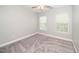 Well-lit bedroom with neutral walls, plush carpeting, and bright windows at 520 Camden Yards Way, Cary, NC 27519