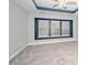Comfortable bedroom featuring neutral walls, carpeted floors, and a tray ceiling at 520 Camden Yards Way, Cary, NC 27519