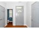 Entryway featuring a gray painted door and hardwood floors at 520 Camden Yards Way, Cary, NC 27519