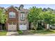 Beautiful townhouse with a two-car garage and manicured lawn at 520 Camden Yards Way, Cary, NC 27519