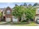 Beautiful townhouse with a two-car garage and manicured lawn at 520 Camden Yards Way, Cary, NC 27519