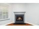 Living room fireplace with hardwood floors and natural light at 520 Camden Yards Way, Cary, NC 27519