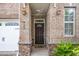 Charming brick home featuring a decorative front door and garage at 520 Camden Yards Way, Cary, NC 27519