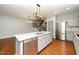 Modern kitchen featuring stainless steel appliances, granite counters, and center island with sink at 520 Camden Yards Way, Cary, NC 27519