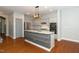 This kitchen features a center island, stainless steel appliances, and granite countertops at 520 Camden Yards Way, Cary, NC 27519