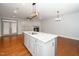 Open kitchen with granite countertops, center island with sink, and stainless steel appliances at 520 Camden Yards Way, Cary, NC 27519