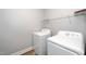 Functional laundry room with washer and dryer and wire shelving at 520 Camden Yards Way, Cary, NC 27519