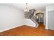 Open living room with hardwood floors, stairway, and lots of natural light at 520 Camden Yards Way, Cary, NC 27519